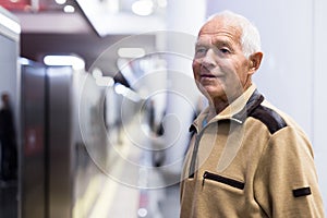 Old man in subway station
