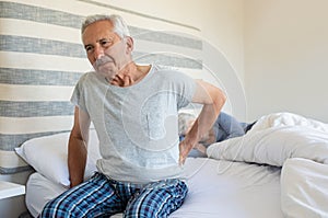 Old man suffering back pain