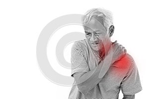 Old man suffering from shoulder muscle inflammation or injury