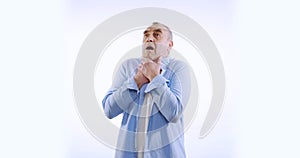 Old man suffocating and suffering sharp chest pain. Isolated on white.