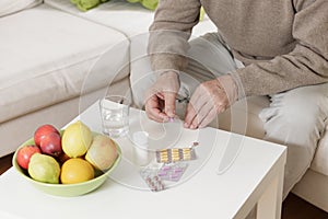 Old man taking medicines