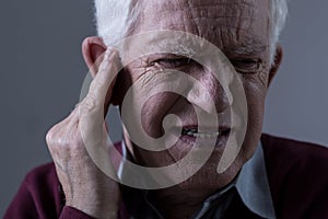 Old man with tinnitus