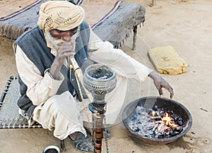 Old man in traditional attire in Indian village