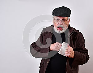 Old man in a trench coat is offering to sell toilet paper at exorbitant prices