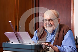 Old man typing on a typewriter