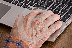 Old man using laptop