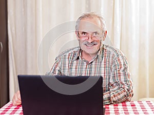 Old man using technology