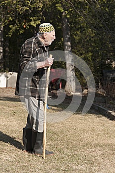 Old man walking on the garden