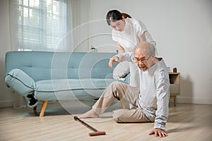 old man with walking stick fall on ground and granddaughter camp to help to