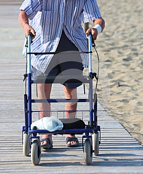 Old man walks with walker