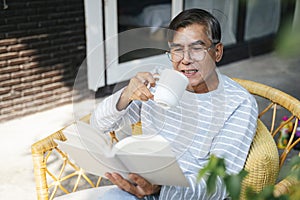 Old man wearing eyeglasses Great book photo