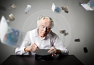 Old man in white and empty wallet. Accounting and taxes.