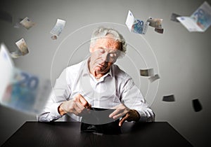 Old man in white and empty wallet. Accounting and taxes.