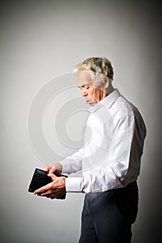 Old man in white and empty wallet.