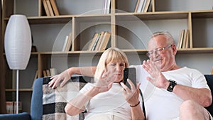 Old man and wife communicate with relatives on Weber, WhatsApp and messenger.