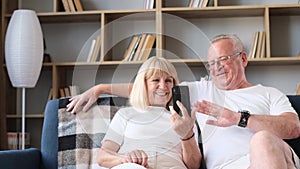 Old man and wife communicate with relatives on Weber, WhatsApp and messenger.