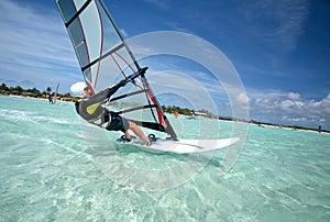 Old man windsurfing on Bonaire. photo