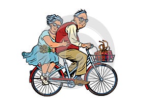 Old man and woman couple in love, riding a bike