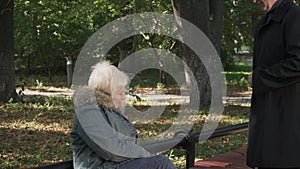 Old man and woman have met at the park