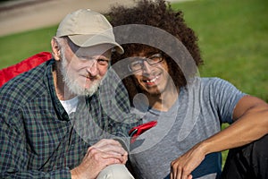 Old man and young man spending time together