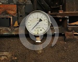Old manometer with white scale
