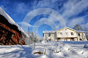 Old manor house in a snowy winter scenery