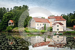 An old manor house Vihula in Estonia, Lahemaa park. Beautiful summer landscape with pond