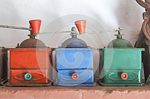 Old manual colorful coffee grinders