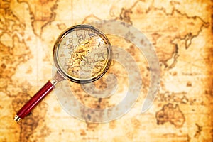 Old map with an magnifying glass