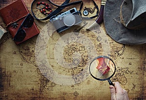 Old map and vintage travel equipment / expedition concept, treasure hunt photo