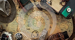 Old map, vintage travel equipment and souvenirs from the travel around the world