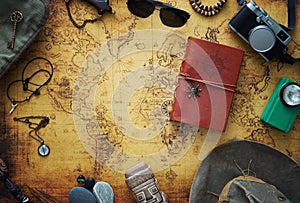 Old map, vintage travel equipment and souvenirs from the travel around the world / place for your text