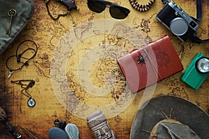 Old map, vintage travel equipment and souvenirs from the travel around the world / place for your text