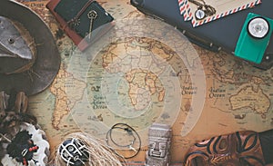 Old map, vintage travel equipment and souvenirs from the travel around the world / place for your text