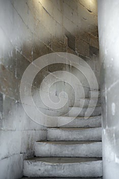 Old marble stairs in Tuscany in a circular staircase