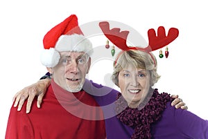 Old married couple in Santa hat and antlers