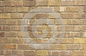 Old masonry from a rectangular large stone of gray-brown color