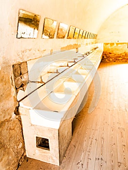 Old mass bathroom in prison