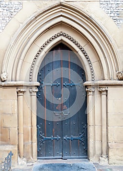 Old massive church door of the catholic church