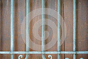 Old massive door with decorative door handle and lock, all still functional