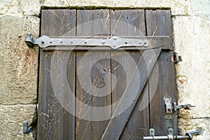 Old massive door with decorative door handle and lock, all still functional