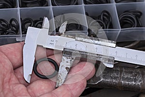 An old measuring tool and a set of sealing gaskets for pneumatics and hydraulics