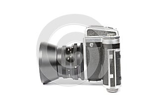 Old mechanical 50mm photo camera isolated on white background