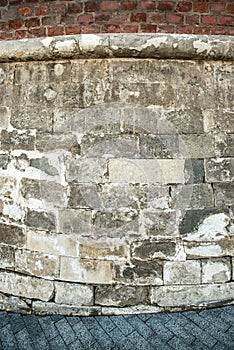 Old medieval brick gray wall