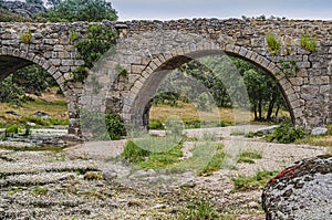 Old medieval bridge with five arches. Ledesma Salamanca Spain photo