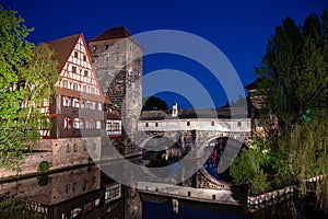 Old medieval bridge at night over Pegnitz river in Nuremberg, Germany