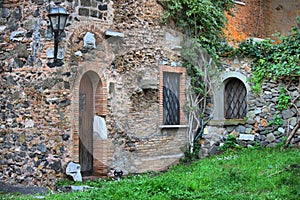 Old medieval with brown wooden door