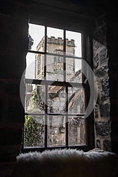 Old medieval churched viewed through pane glass window