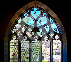 Old medieval colorful leaded-pane windows in gothic style