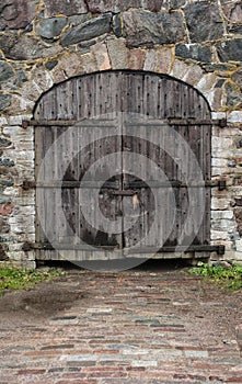 Old medieval door and stone wall texture